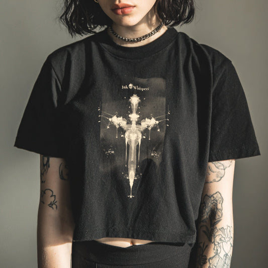 Person wearing a black t-shirt with a graphic design against a plain background