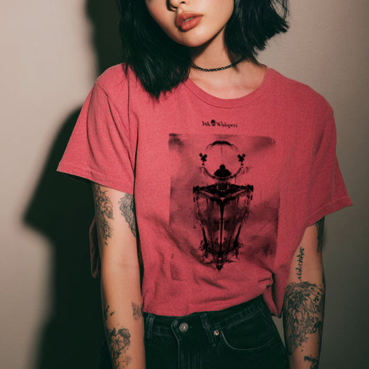 Person wearing a pink t-shirt with a graphic design against a plain background